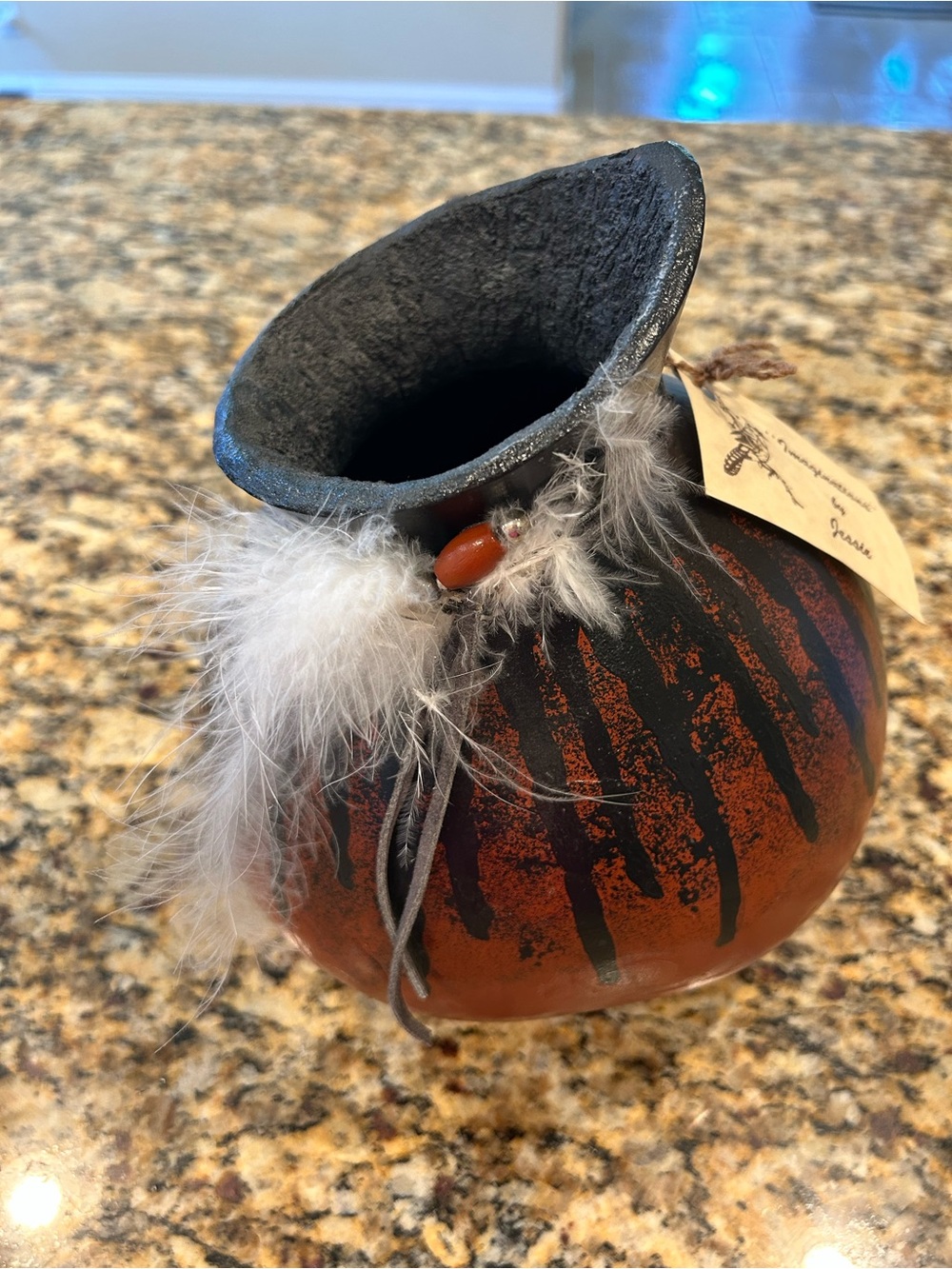 Handcrafted Indian Artwork Gourd with Feather & Leather Accents